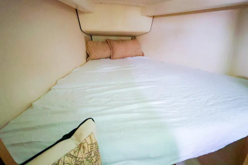 Slide: The Image of Cozy cabin bed in 2019 Hanse 315 sailboat with white bedding and pillows. - 14