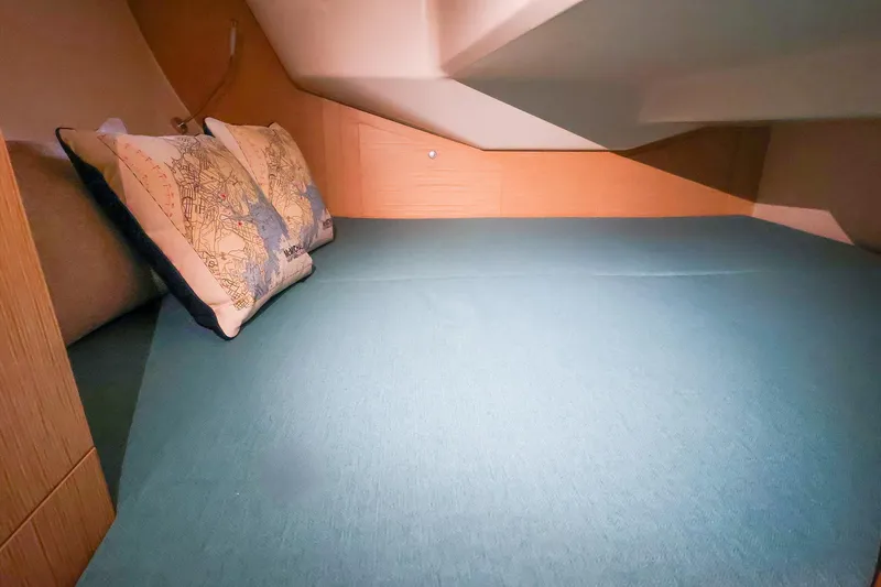 Slide: The Image of Cozy cabin interior of 2019 Hanse 315 yacht with nautical-themed pillows. - 16