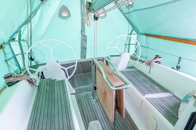 Slide: The Image of Interior view of 2019 Hanse 315 sailboat cockpit with dual steering wheels. - 17