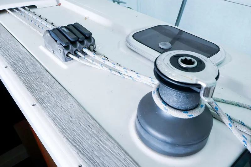 Slide: The Image of Close-up of a 2019 Hanse 315 sailboat winch and rope system. - 24