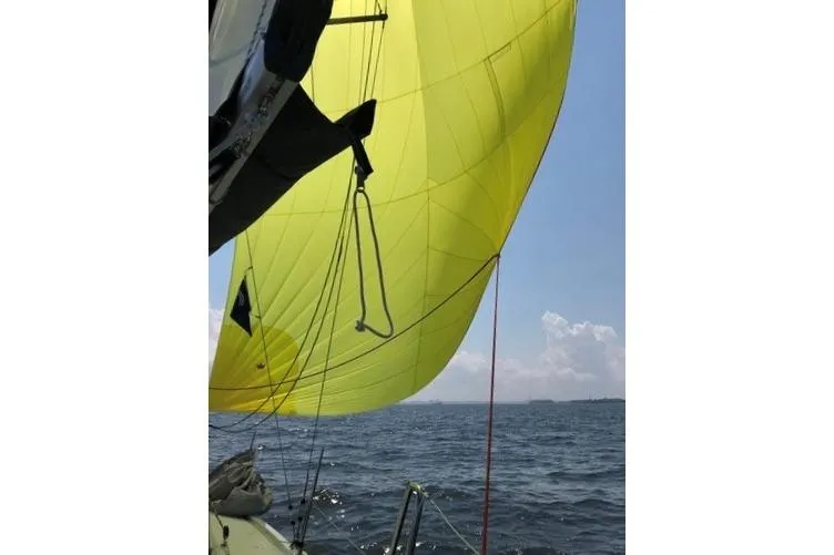 Slide: The Image of Yellow sail on 2019 Hanse 315 yacht against blue sky and ocean. - 29