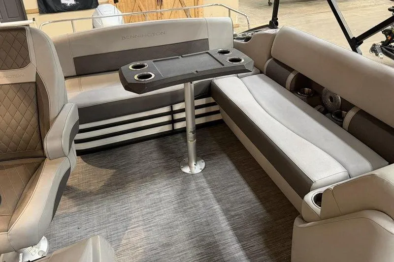 Slide: The Image of Interior of a 2021 Bennington 20 LSB pontoon boat with seating and table. - 14