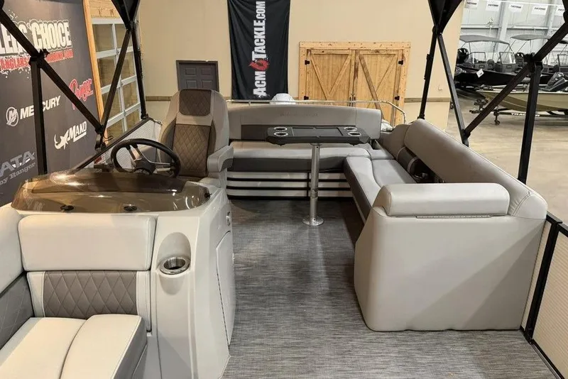 Slide: The Image of 2021 Bennington 20 LSB pontoon boat interior with plush seating and steering console. - 15