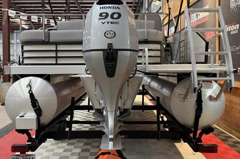 Slide: The Image of 2021 Bennington 20 LSB pontoon boat with Honda 90 VTEC engine on display. - 3
