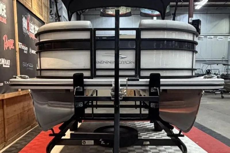 Slide: The Image of 2021 Bennington 20 LSB pontoon boat on display in a showroom. - 4