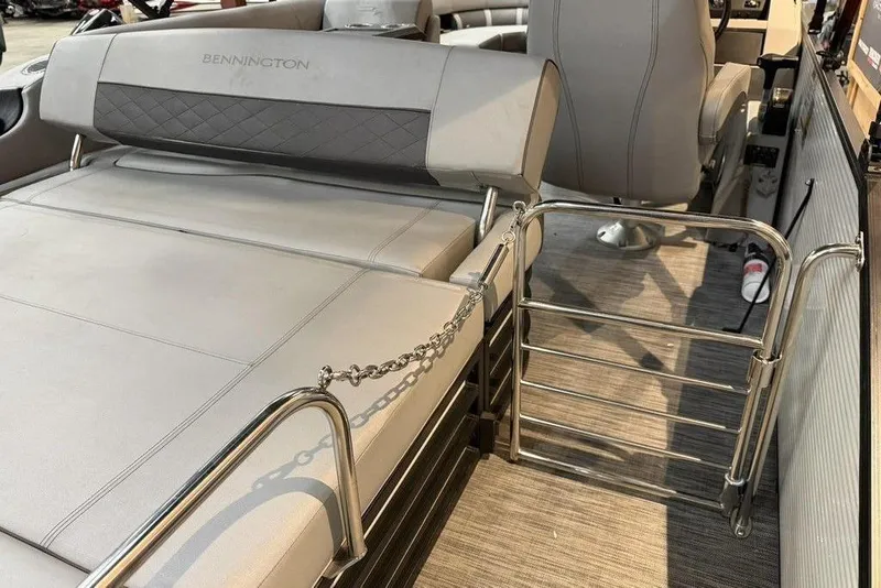 Slide: The Image of 2021 Bennington 20 LSB boat interior with gray seating and metal railing. - 5