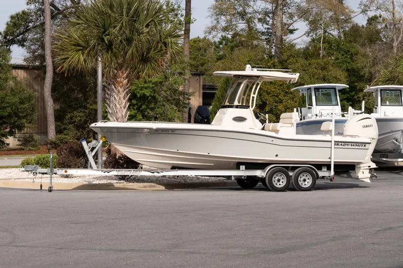 The Image of 2024 Grady-White 251 Coastal Explorer boat on trailer, parked outdoors. - 10