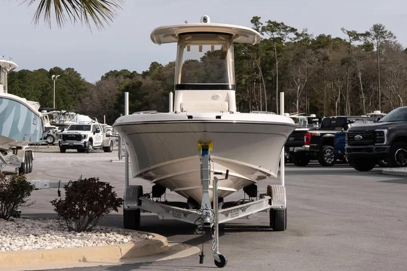 Slide: The Image of 2024 Grady-White 251 Coastal Explorer boat on trailer in parking lot. - 11