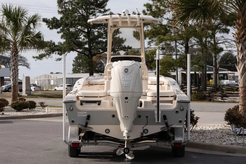 Slide: The Image of 2024 Grady-White 251 Coastal Explorer boat with Yamaha V6 engine, parked outdoors. - 13
