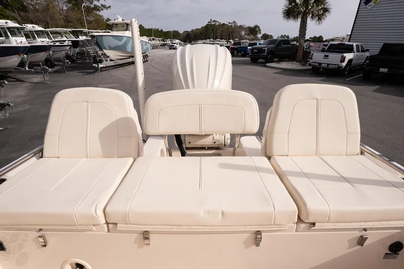 Slide: The Image of 2024 Grady-White 251 Coastal Explorer boat with beige seating, parked outdoors. - 17
