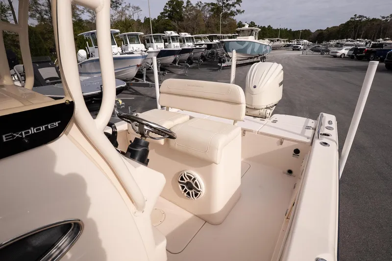 Slide: The Image of 2024 Grady-White 251 Coastal Explorer boat interior with helm and seating area. - 21
