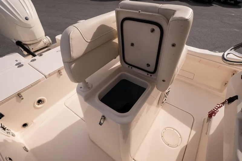 Slide: The Image of 2024 Grady-White 251 Coastal Explorer boat interior with open storage compartment. - 23