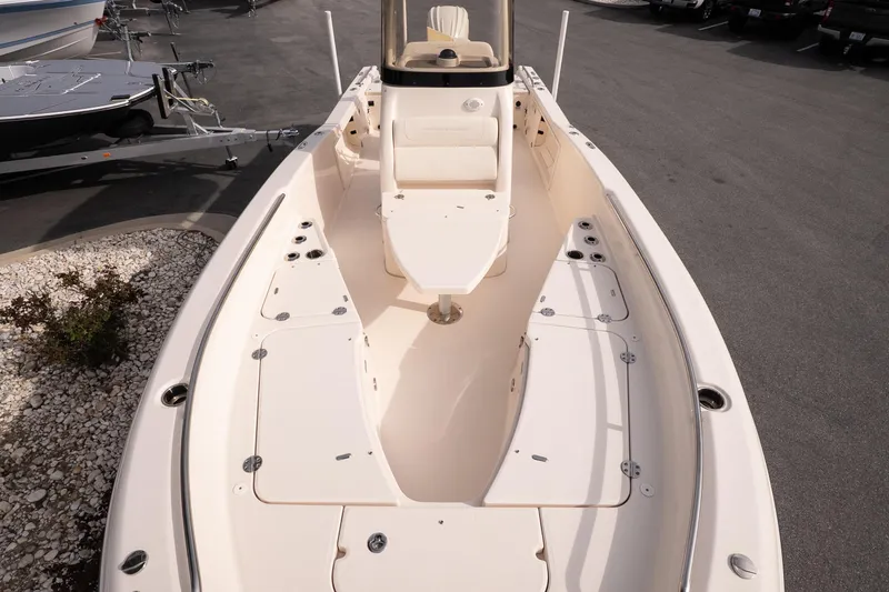 Slide: The Image of 2024 Grady-White 251 Coastal Explorer boat interior with seating and storage compartments. - 27