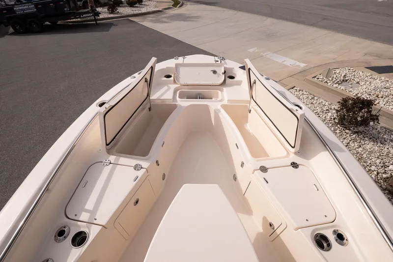 Slide: The Image of 2024 Grady-White 251 Coastal Explorer boat with open storage compartments. - 28