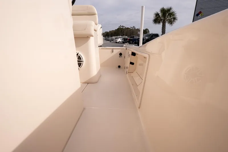 Slide: The Image of 2024 Grady-White 251 Coastal Explorer boat interior with seating and storage compartments. - 29