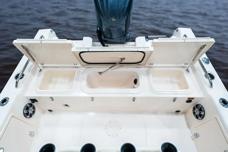 Slide: The Image of Manufacturer Provided Image: 2024 Grady-White 251 Coastal Explorer boat deck with storage compartments and motor. - 3
