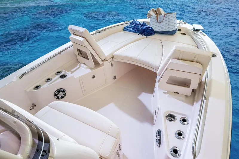 Slide: The Image of Manufacturer Provided Image: 2024 Grady-White 251 Coastal Explorer boat interior with seating and ocean view. - 6