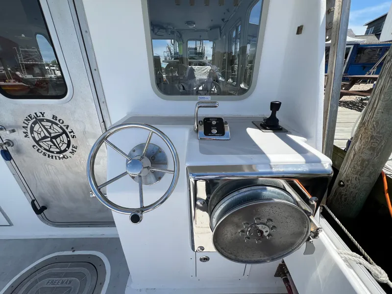Slide: The Image of Wesmac 38 boat helm with steering wheel and controls, 2022 model. - 16