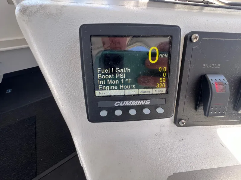 Slide: The Image of Dashboard of 2022 Wesmac 38 boat showing Cummins engine metrics. - 29
