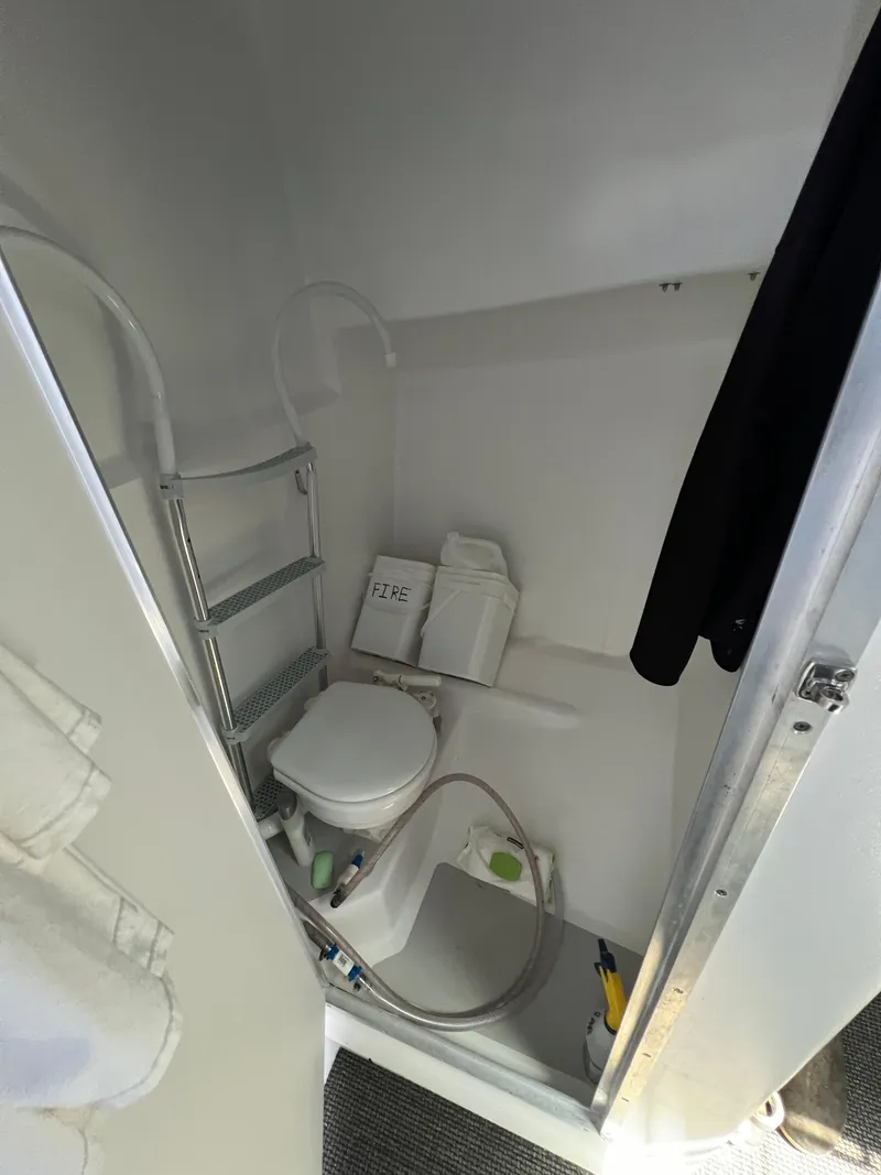 Slide: The Image of Compact bathroom in 2022 Wesmac 38 boat with toilet and shower. - 43