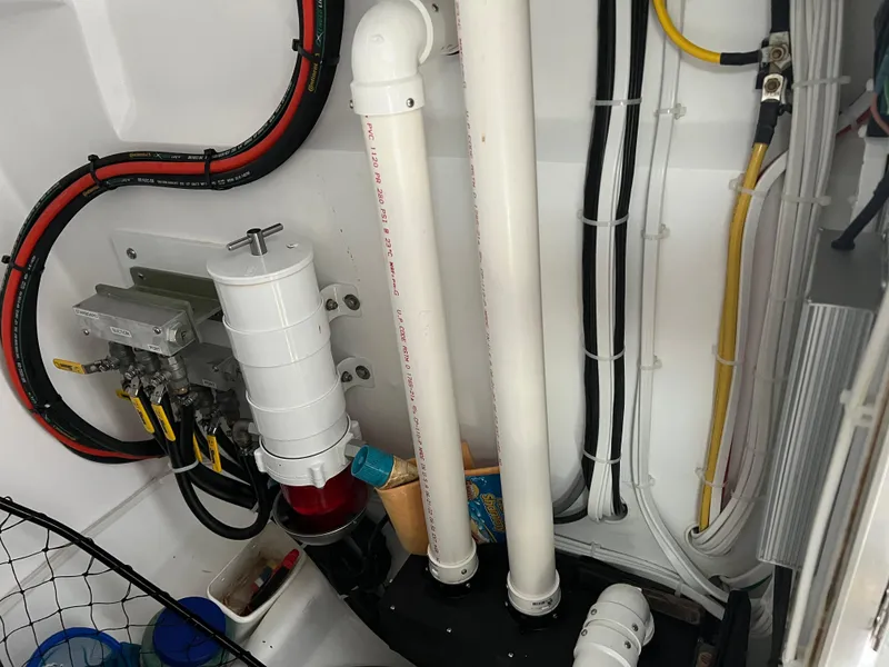 Slide: The Image of Engine room of 2022 Wesmac 38 boat with pipes and wiring. - 44