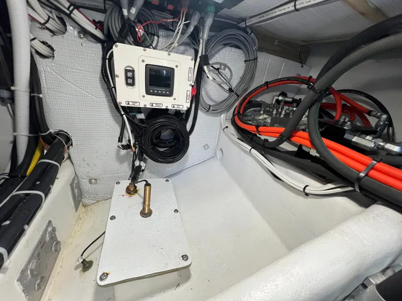 Slide: The Image of Engine room of 2022 Wesmac 38 boat with control panel and wiring. - 47