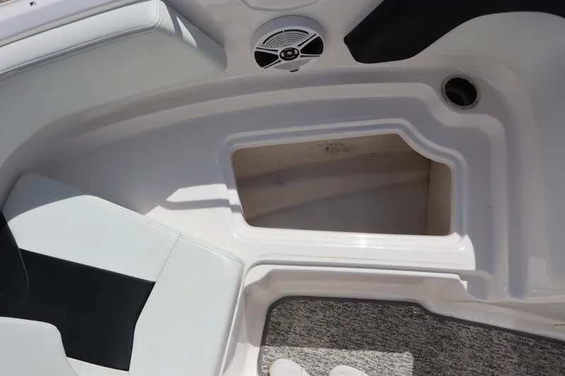 Slide: The Image of Interior storage compartment of 2017 Chaparral 21 H2O Sport boat with speaker detail. - 10