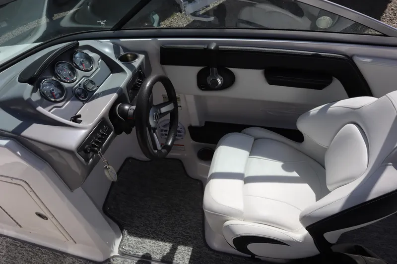 Slide: The Image of Interior of 2017 Chaparral 21 H2O Sport boat with steering wheel and gauges. - 15