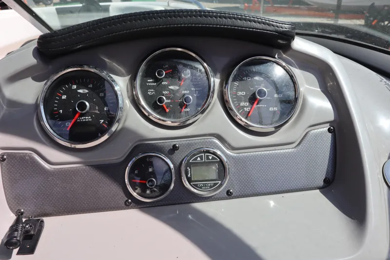 Slide: The Image of Dashboard of a 2017 Chaparral 21 H2O Sport boat with gauges and controls. - 16