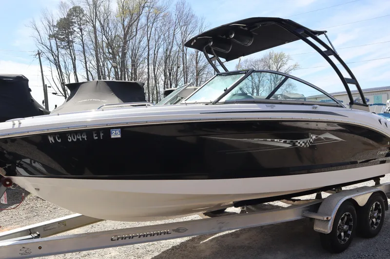 Slide: The Image of 2017 Chaparral 21 H2O Sport boat on trailer, black and white design. - 2