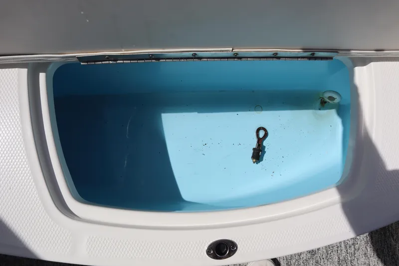 Slide: The Image of Open storage compartment in 2017 Chaparral 21 H2O Sport boat. - 24