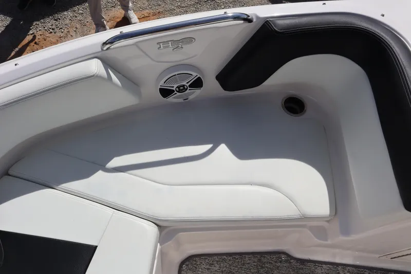 Slide: The Image of Interior seating of a 2017 Chaparral 21 H2O Sport boat with speaker detail. - 9