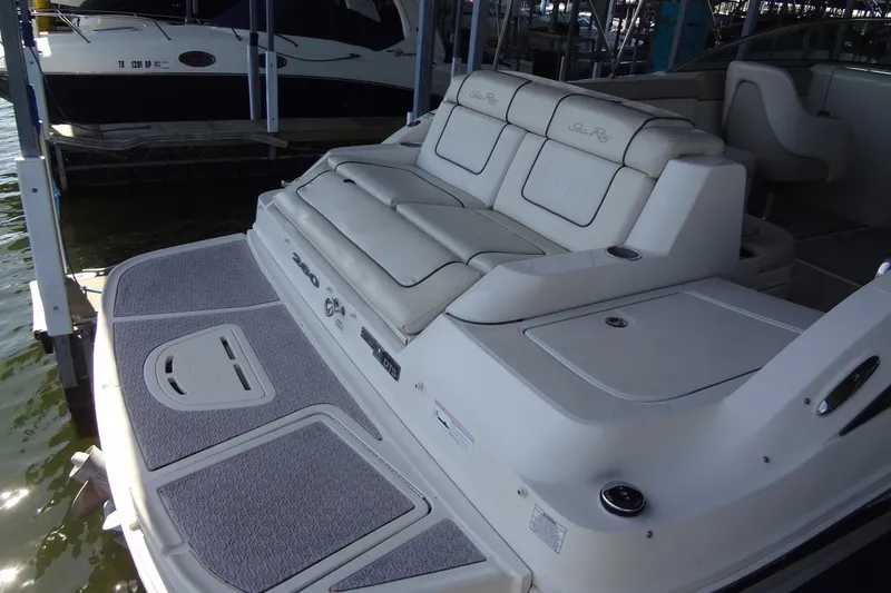 Slide: The Image of 2010 Sea Ray 260 Sundeck boat with spacious seating and swim platform. - 18