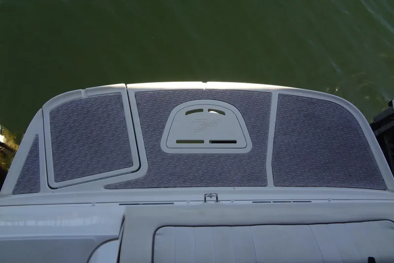 Slide: The Image of 2010 Sea Ray 260 Sundeck swim platform with textured surface, overlooking water. - 19