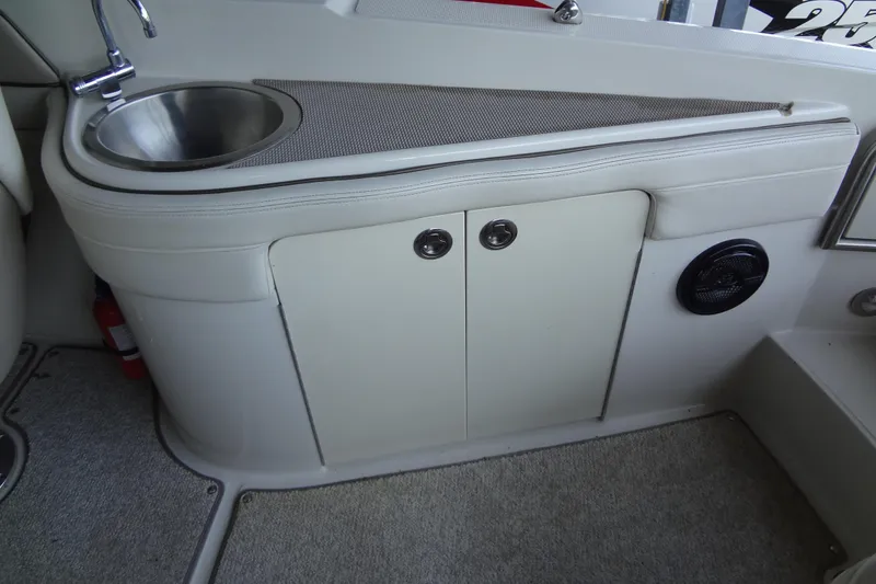Slide: The Image of Interior of 2010 Sea Ray 260 Sundeck with sink and storage cabinet. - 28