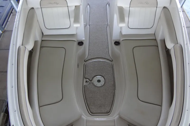 Slide: The Image of Interior view of a 2010 Sea Ray 260 Sundeck boat with beige seating. - 31