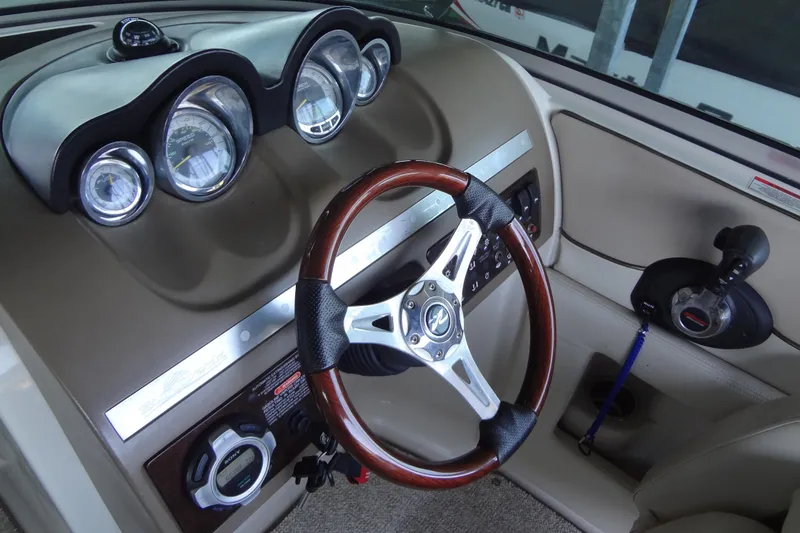 Slide: The Image of Steering console of a 2010 Sea Ray 260 Sundeck boat with gauges and controls. - 40