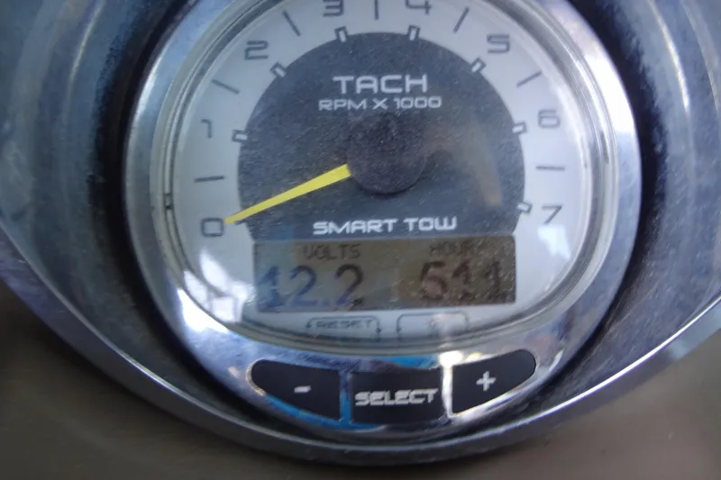 Slide: The Image of Tachometer of 2010 Sea Ray 260 Sundeck displaying RPM and voltage readings. - 41