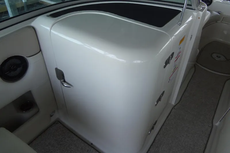 Slide: The Image of Interior view of a 2010 Sea Ray 260 Sundeck boat, featuring a storage compartment. - 45