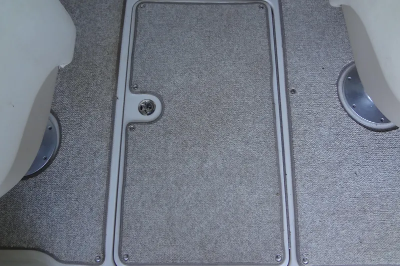 Slide: The Image of Carpeted deck of a 2010 Sea Ray 260 Sundeck boat. - 48