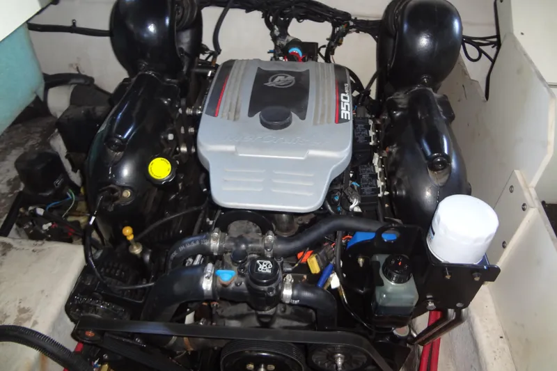 Slide: The Image of Engine of a 2010 Sea Ray 260 Sundeck boat, showcasing mechanical components. - 51