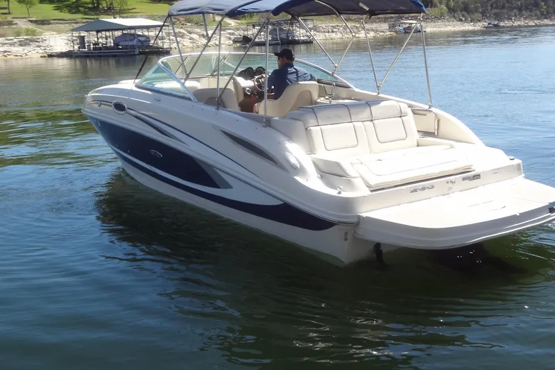 Slide: The Image of 2010 Sea Ray 260 Sundeck boat cruising on a sunny lake. - 6