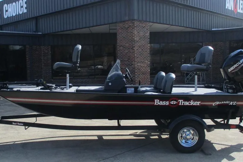 The Image of 2026 Tracker Bass Tracker Classic XL boat on trailer outside dealership. - 1