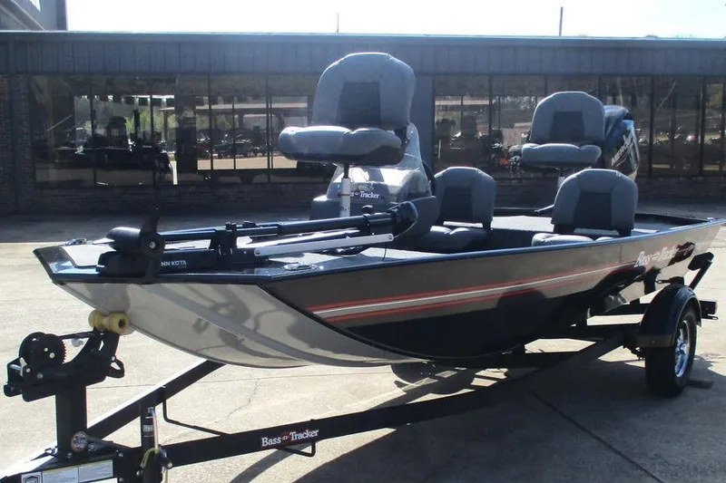 Slide: The Image of 2026 Tracker Bass Tracker Classic XL fishing boat on trailer, parked outdoors. - 5