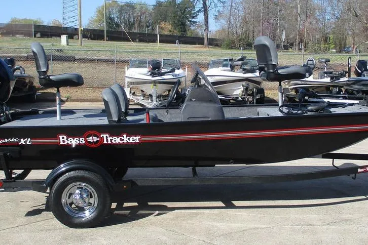 Slide: The Image of 2026 Tracker Bass Tracker Classic XL boat on trailer, parked outdoors. - 8