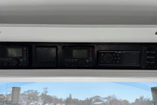 Slide: The Image of 2012 Shearline Express Fisherman dashboard with navigation and communication equipment. - 10