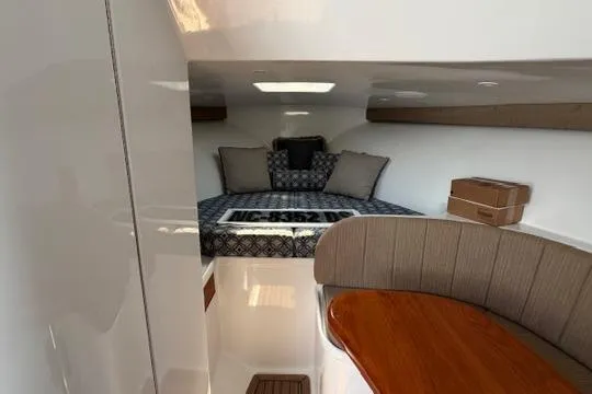 Slide: The Image of Interior cabin of 2012 Shearline Express Fisherman with cozy bed and seating area. - 11