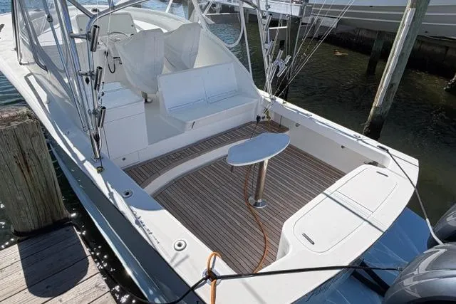 Slide: The Image of 2012 Shearline Express Fisherman boat with spacious deck and seating at dock. - 2