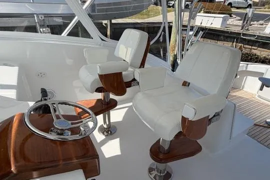 Slide: The Image of Luxurious 2012 Shearline Express Fisherman boat interior with white leather seats and wooden accents. - 6