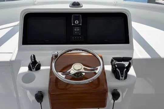 Slide: The Image of Helm of 2012 Shearline Express Fisherman with steering wheel and control panel. - 8